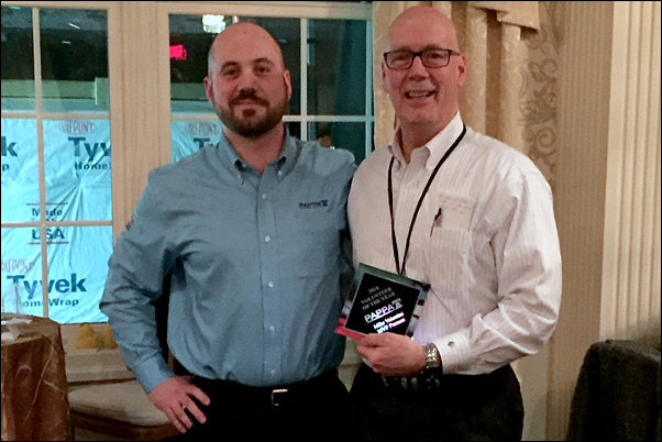 Mike Valentini, Sr., accepts the regional association's Volunteer of the Year award from his son, Mike Valentini, Jr.