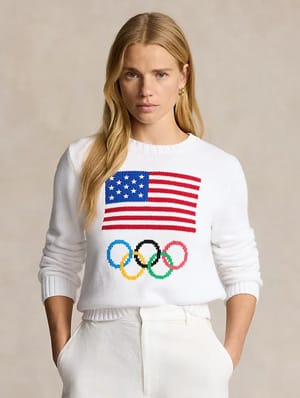 woman wearing white sweater with US flag and Olympic rings